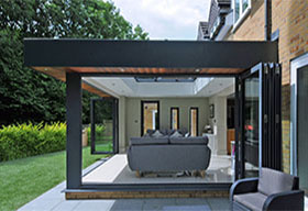 Bi folding doors on this modern orangery gives this property a light and airy feel